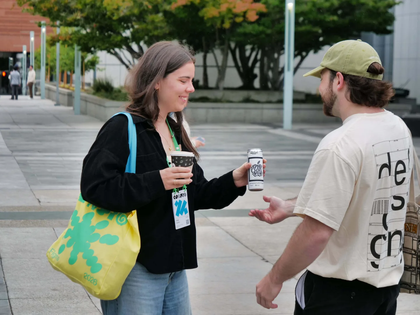 A woman handing out a Paper can